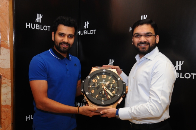 Cricketer Rohit Sharma (R) presents Mr.Sharjeel Khan (L), Director, Zimson the exclusive Hublot Clock